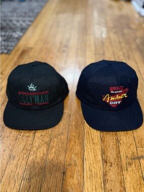 Two Vintage Snapback Caps - Black Sleeman & Navy Amber Dry Alcohol Brands